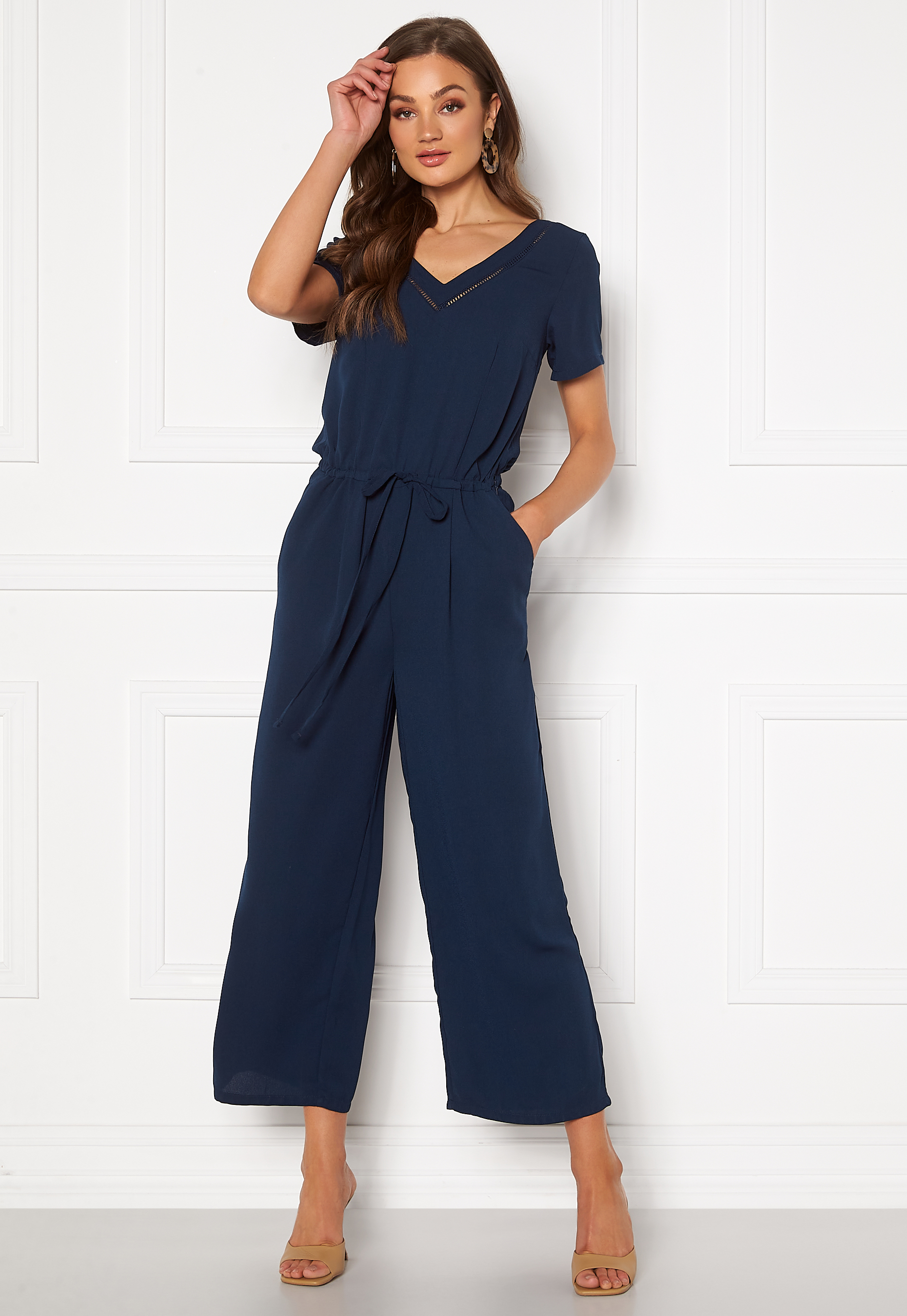 navy blue jumpsuit with blazer